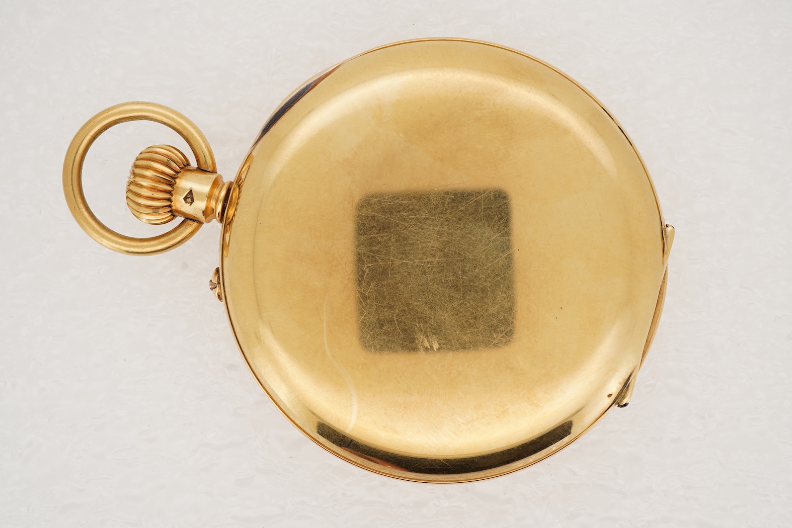 A George V 18ct gold half hunter keyless lever pocket watch, retailed by Mappin